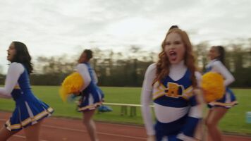 Cheerleader Madelaine Petsch giving a peak at her undies in front of everyone.