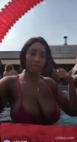 Bikini tops can barely hold her tits