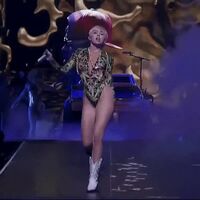 Miley Cyrus shaking her tight, plump little ass like the slut that she is.